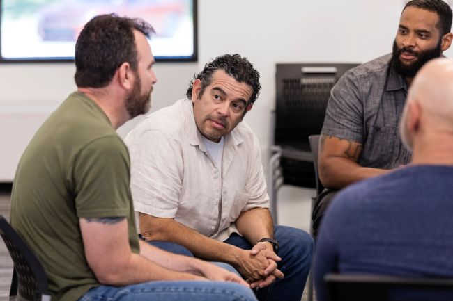 Men in a support group meeting.