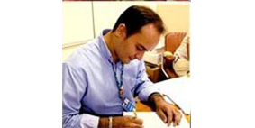 Image of a man working at a desk