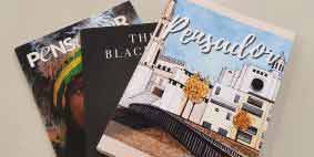 Image showing a fan of 3 magazines we have produced for our customers
