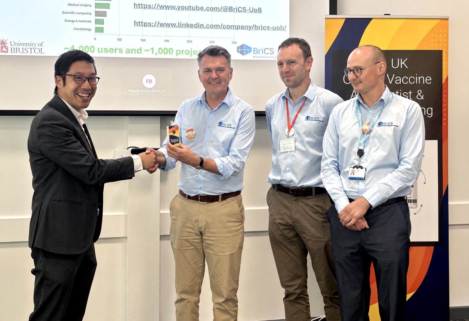 Scientists from the University of Oxford presenting award to BriCS team