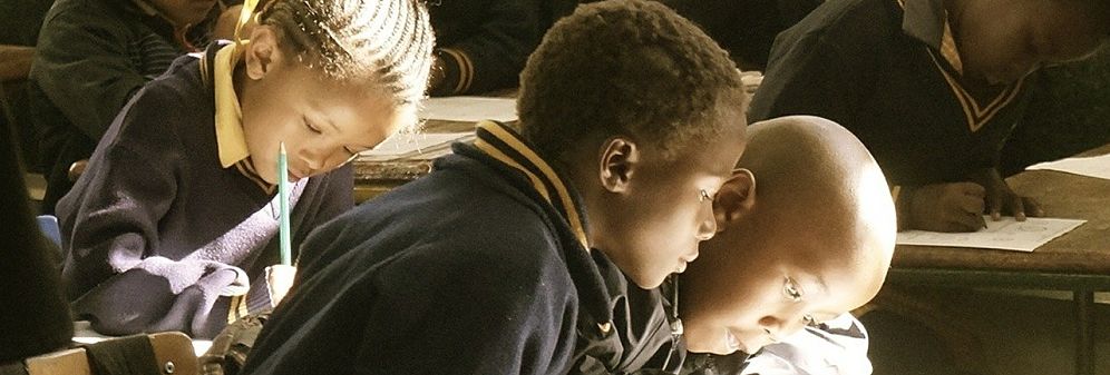 Schoolchildren at their desks in sub-Saharan Africa.