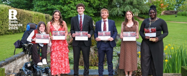 Bristol Red 2026 winners L-R: Sally, Katy, Caspar, Scott, Grace and Funmi hold up their certificates in the gardens at Goldney Hall.