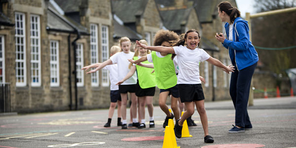 Kids in playground with instructor