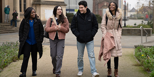 Students walking by Royal Fort