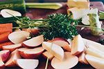 Chopping board displaying seletion of raw vegetables