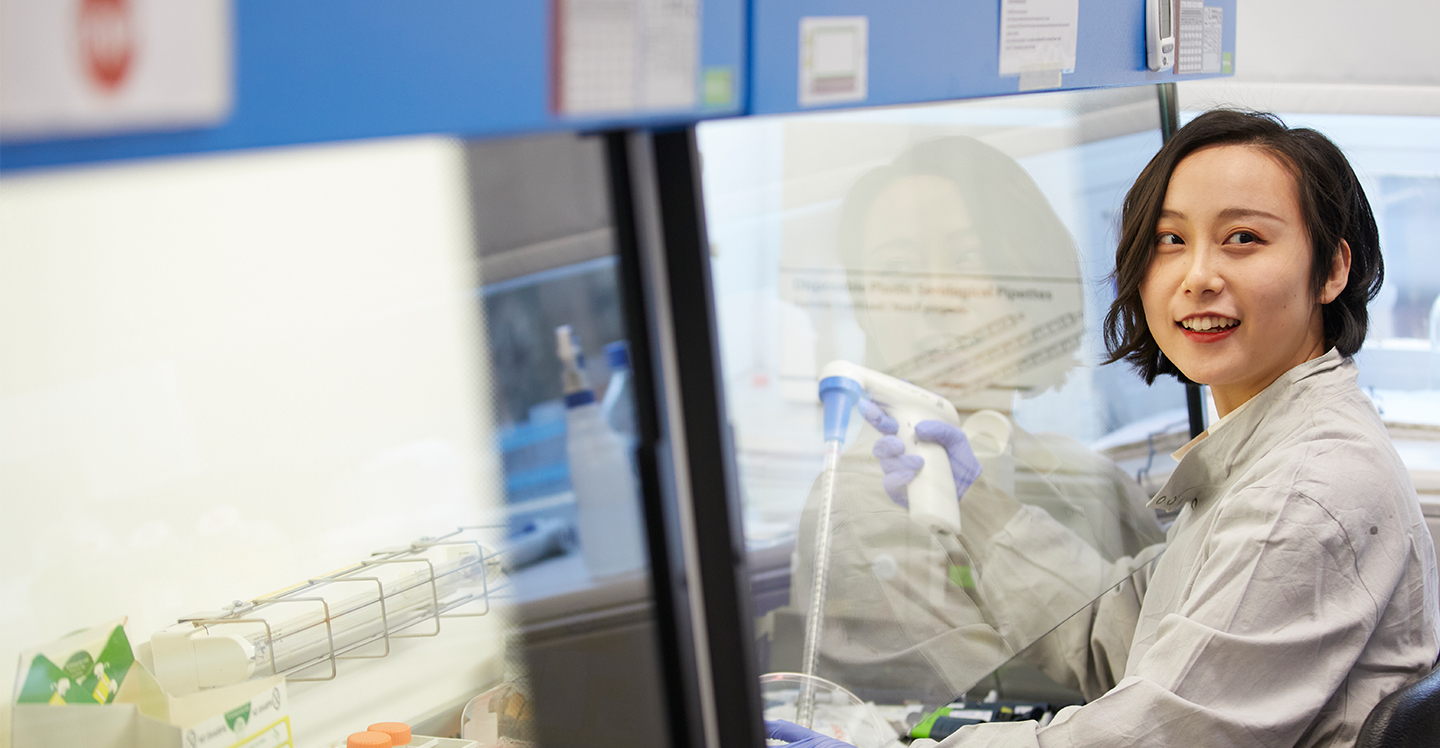 A student in the Biomedical Sciences building