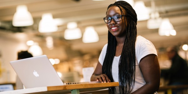 A student working on a laptop at the University of Bristol