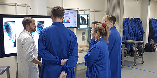 Students looking at X-ray scans.