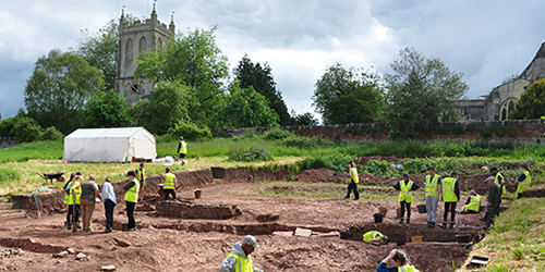 Students working on an archaeological dig site.