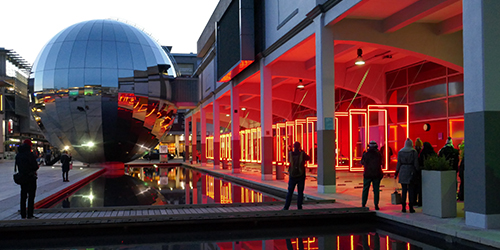 Red lights in the evening at We the Curious in Millennium Square, Bristol.