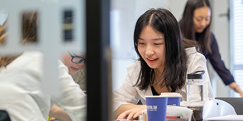 Students sat together in a social area on campus. 