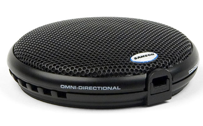 A close-up picture of the boundary microphone model used in Re/Play equipped rooms. The mic is roughly the size and shape of a large eccles cake.