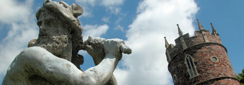 Head of the Goldney Gardens statue with top of the Goldney Folly in background 