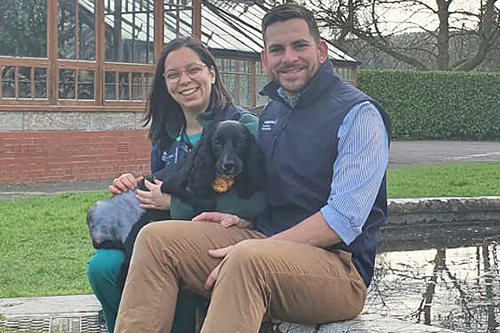 dog with veterinary surgeon and veterinary nurse